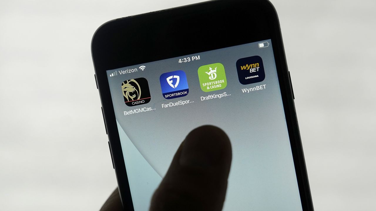 FanDuel, DraftKings and other online gambling apps are displayed on a phone. (AP Photo/Jeff Chiu, File)