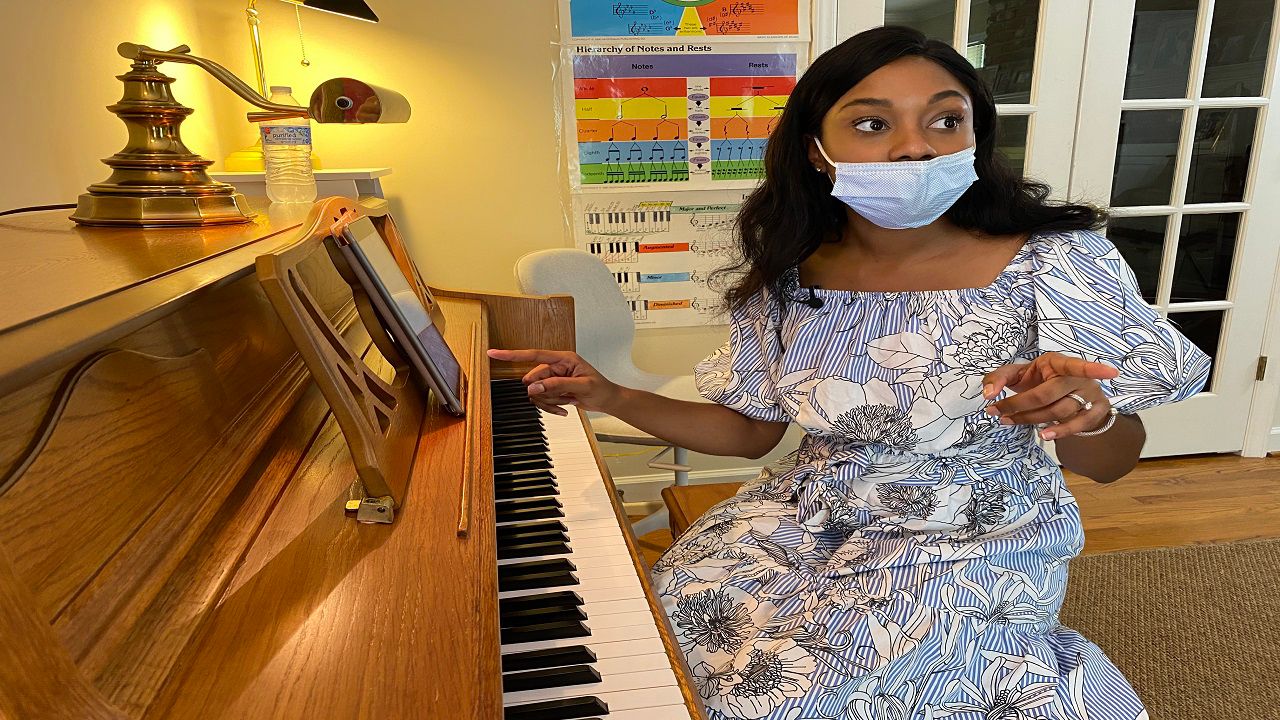 Mahari Freeman works with a student during a voice lesson as part of her new music school, La Voix Academy 
