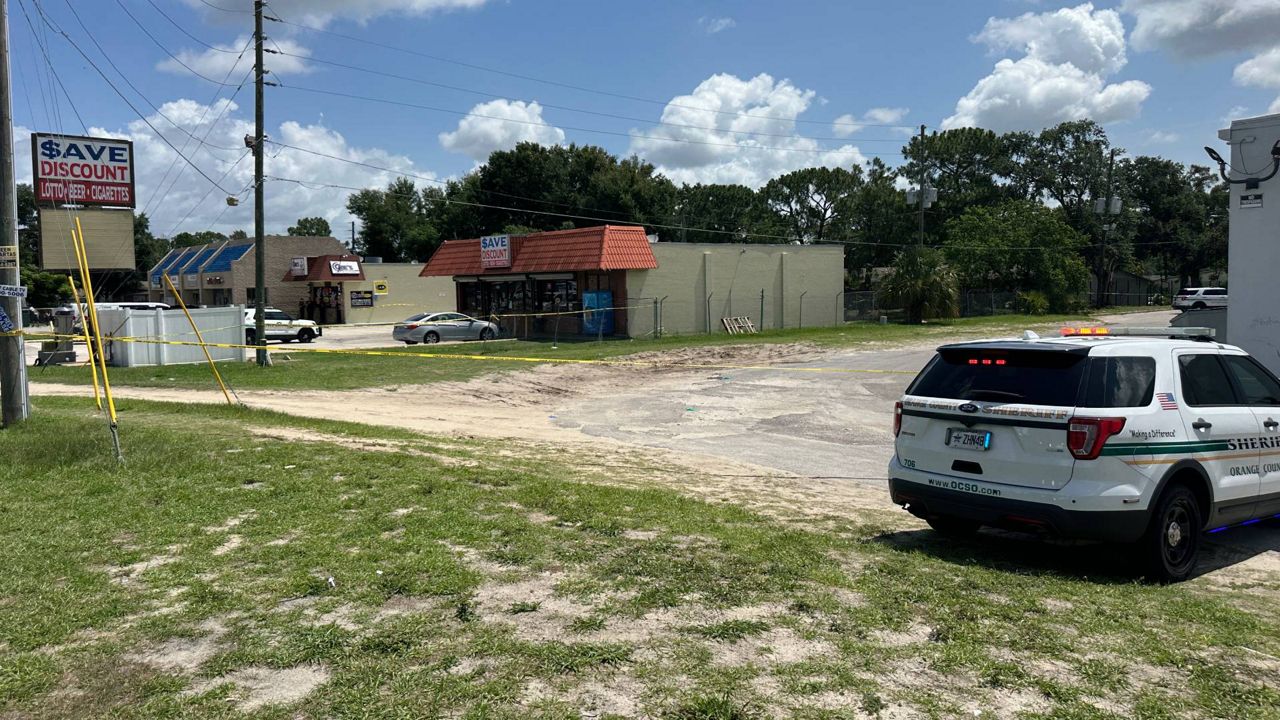 Orange County Sheriff John Mina said one of his deputies was attacked behind the Save Discount store on North Hiawassee Road in Orlando. (Spectrum News/Philip Petersen)