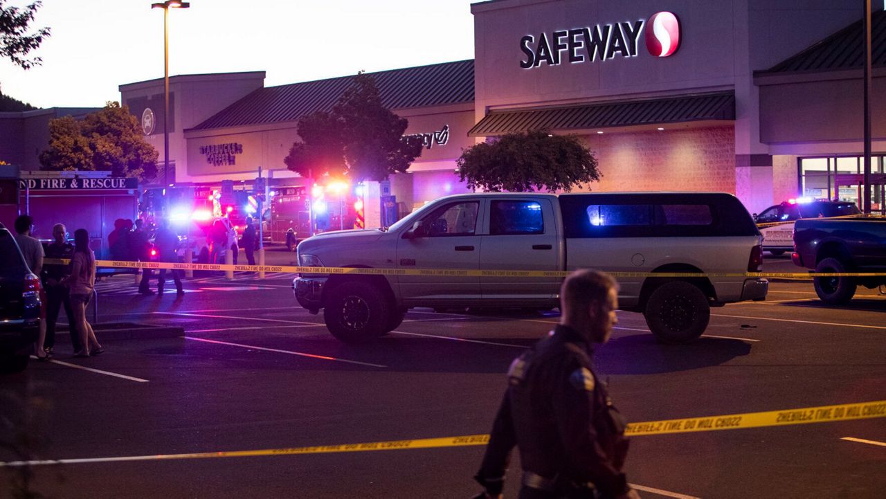 Emergency personnel respond Sunday to a shooting at the Forum Shopping Center in Bend, Ore. (Ryan Brennecke/The Bulletin via AP)