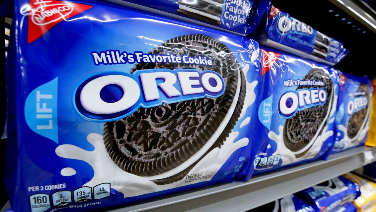 Packages of Nabisco Oreo cookies line a shelf in a market in Pittsburgh. (AP Photo/Gene J. Puskarc, File)