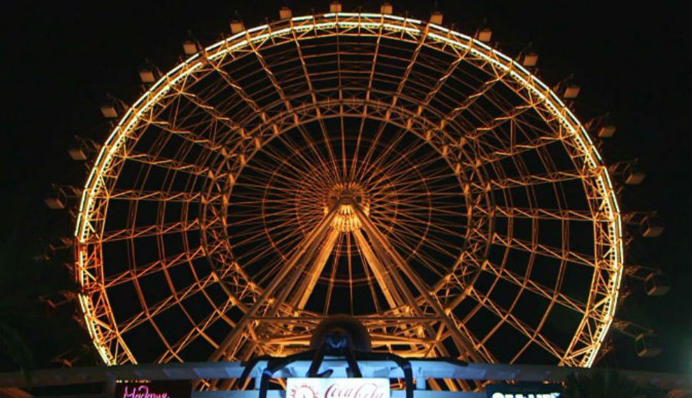 As part of a Halloween celebration, The Coca-Cola Orlando Eye has been transformed into a giant spider web.