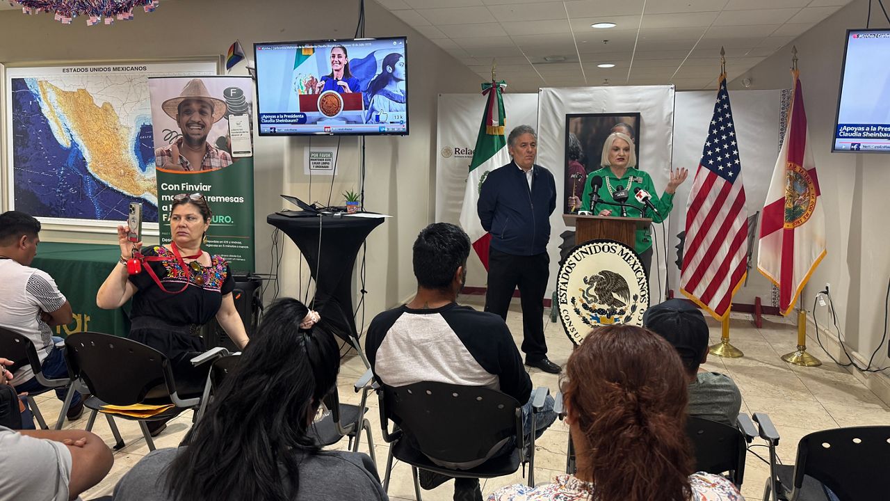 Mexican consul Juan Sabines (left) and former State Sen. Linda Stewart host a press conference Friday to address the impact of immigration enforcement on Latino-owned businesses in Orlando. (Spectrum News/Massiel Leyva)