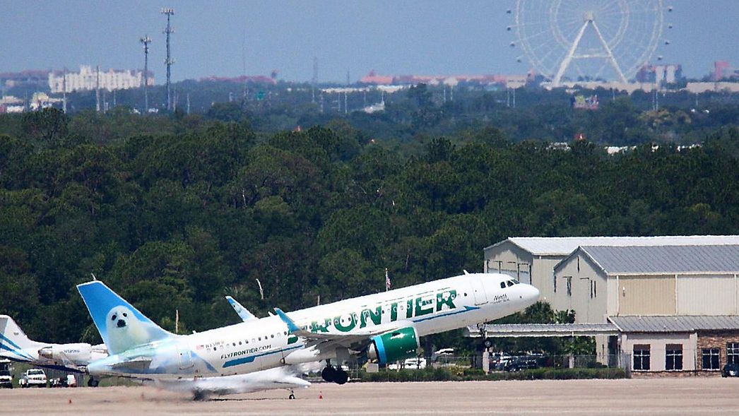 A Frontier Airlines flight departs Orlando International Airport (Spectrum News 13/Greg Angel)