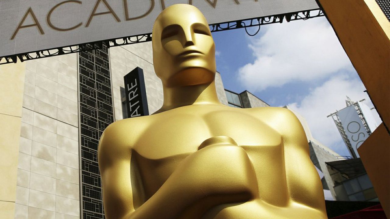 Oscar statue appears outside the Dolby Theatre for the 87th Academy Awards in Los Angeles. (Photo by Matt Sayles/Invision/AP)