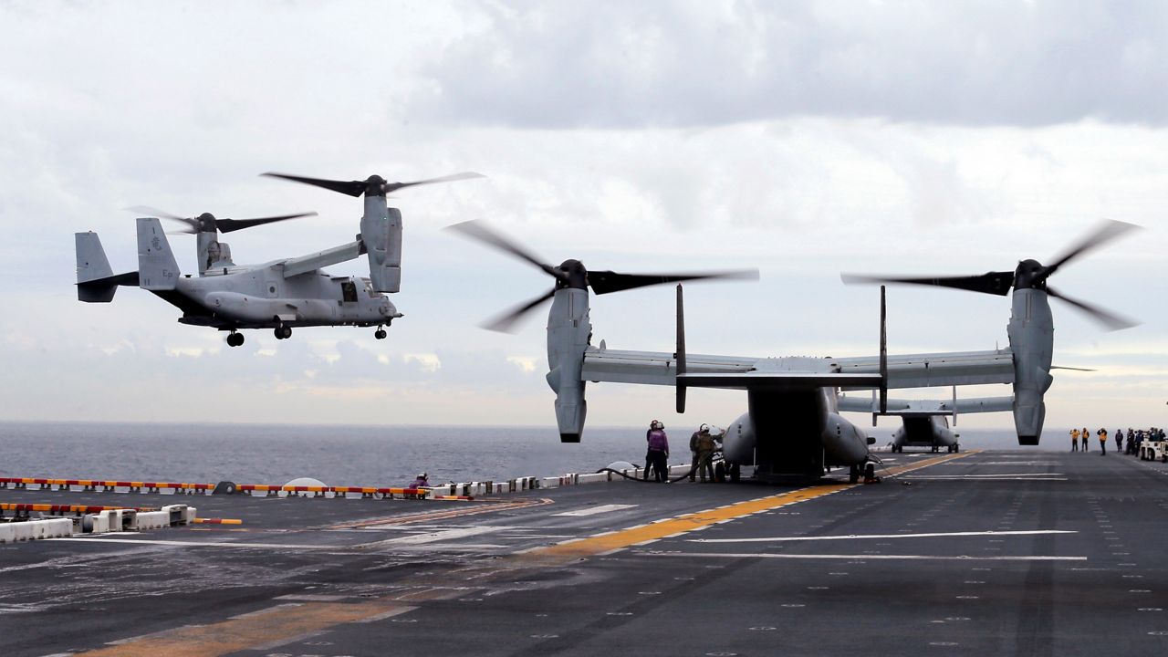 U.S. Marine MV-22B Osprey aircraft land on the deck of the USS Bonhomme Richard. (Jason Reed/Pool Photo via AP)