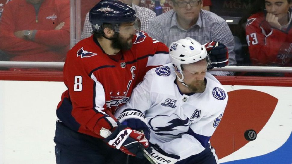 Washington Capitals left wing Alex Ovechkin (8), from Russia, collides with Tampa Bay Lightning defenseman Anton Stralman (6), from Sweden, during the third period of Game 6 of the NHL Eastern Conference finals hockey playoff series, Monday, May 21, 2018, in Washington. The Capitals won 3-0. (AP Photo/Alex Brandon)