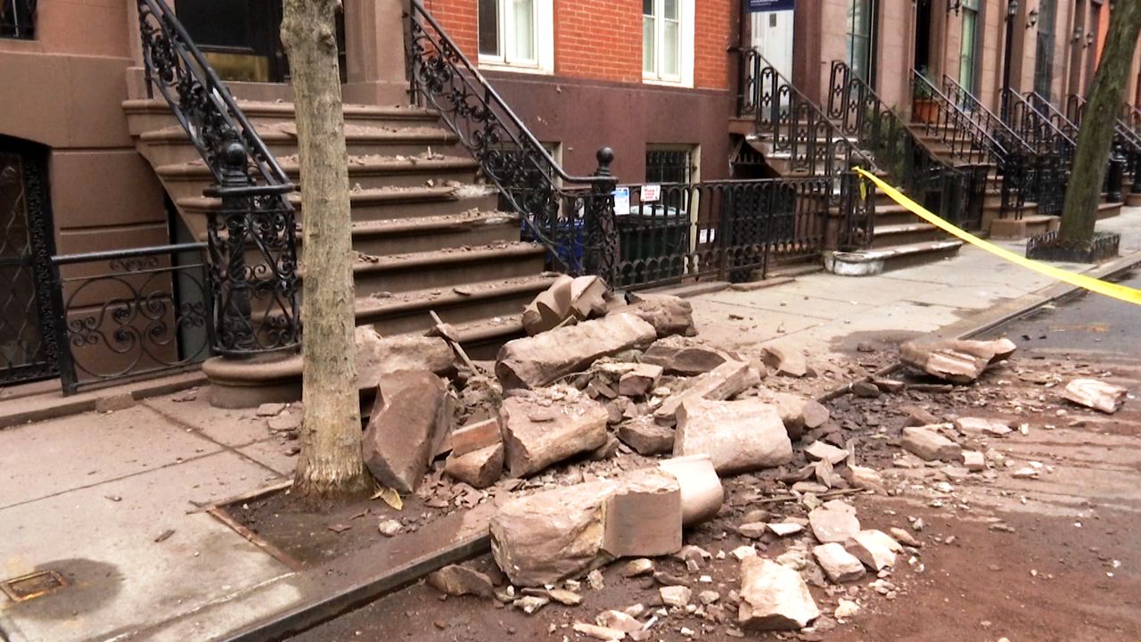 Bricks were seen falling to pavement from an apartment building in Manhattan, no injuries have been reported 