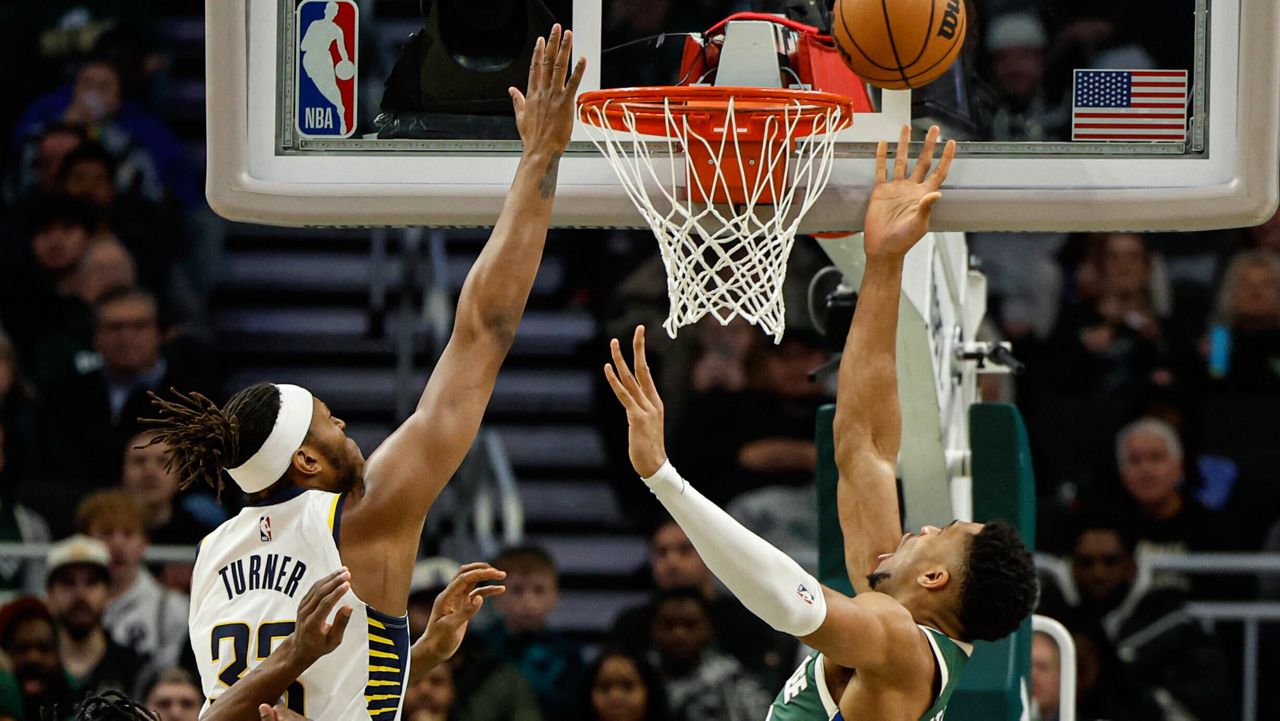 Milwaukee Bucks forward Giannis Antetokounmpo puts up a shot against the Indiana Pacers' Myles Turner 