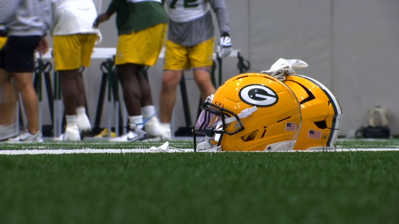 Packers helmet on turf