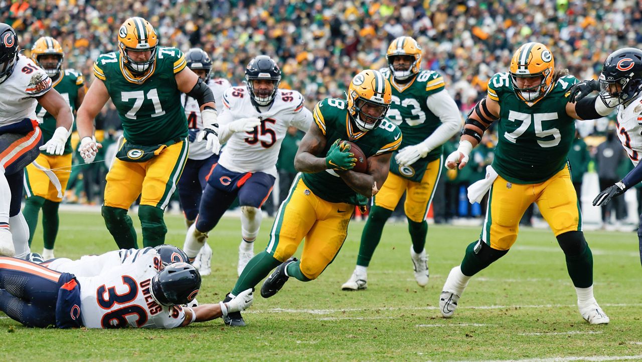 Green Bay Packers running back Josh Jacobs (8) runs for a touchdown during an NFL football game against the Chicago Bears Sunday, Jan. 5, 2025, in Green Bay, Wis. 