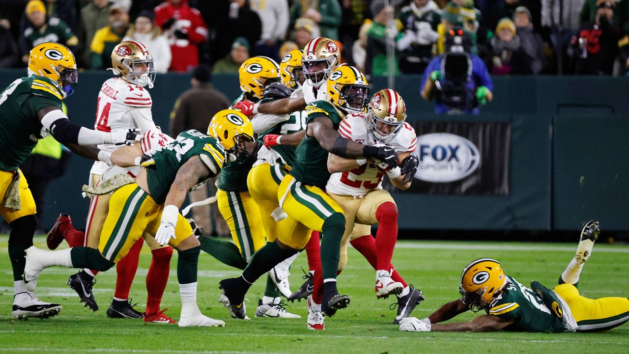 San Francisco 49ers running back Christian McCaffrey (23) runs the ball during the second half of an NFL football game against the Green Bay Packers