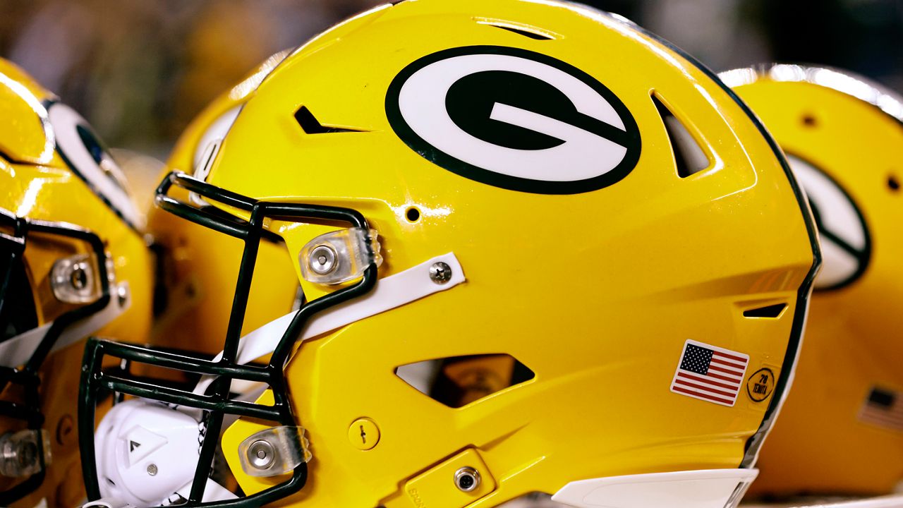 A Green Bay Packers helmet sits on the sidelines during an NFL football game against the Philadelphia Eagles, Sunday, Nov. 27, 2022, in Philadelphia. John Gordon, an artist who as a young art student helped design the Green Bay Packers’ distinctive “G” team logo, died Saturday, Sept. 30, 2023, at age 83. (AP Photo/Rich Schultz)