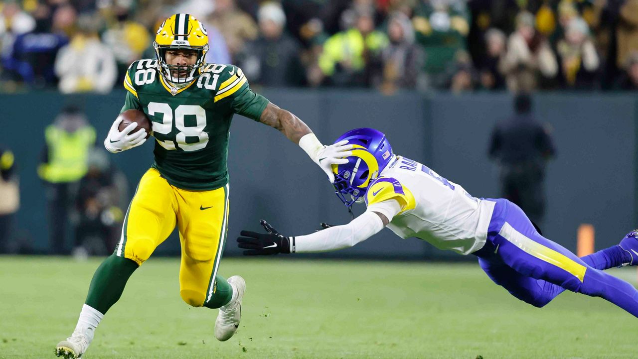 AJ Dillon helps Packers beat Rams to keep playoff hopes alive