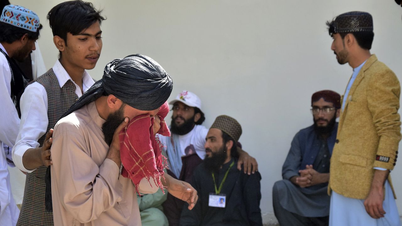 People mourn for their relative, who was killed in a bomb explosion, at a hospital, in Quetta, Pakistan, Friday, Sept. 29, 2023. A powerful bomb exploded at a rally celebrating the birthday of Islam's Prophet Muhammad in southwest Pakistan on Friday, killing multiple people and wounding dozens of others, police and a government official said. (AP Photo/Arshad Butt)