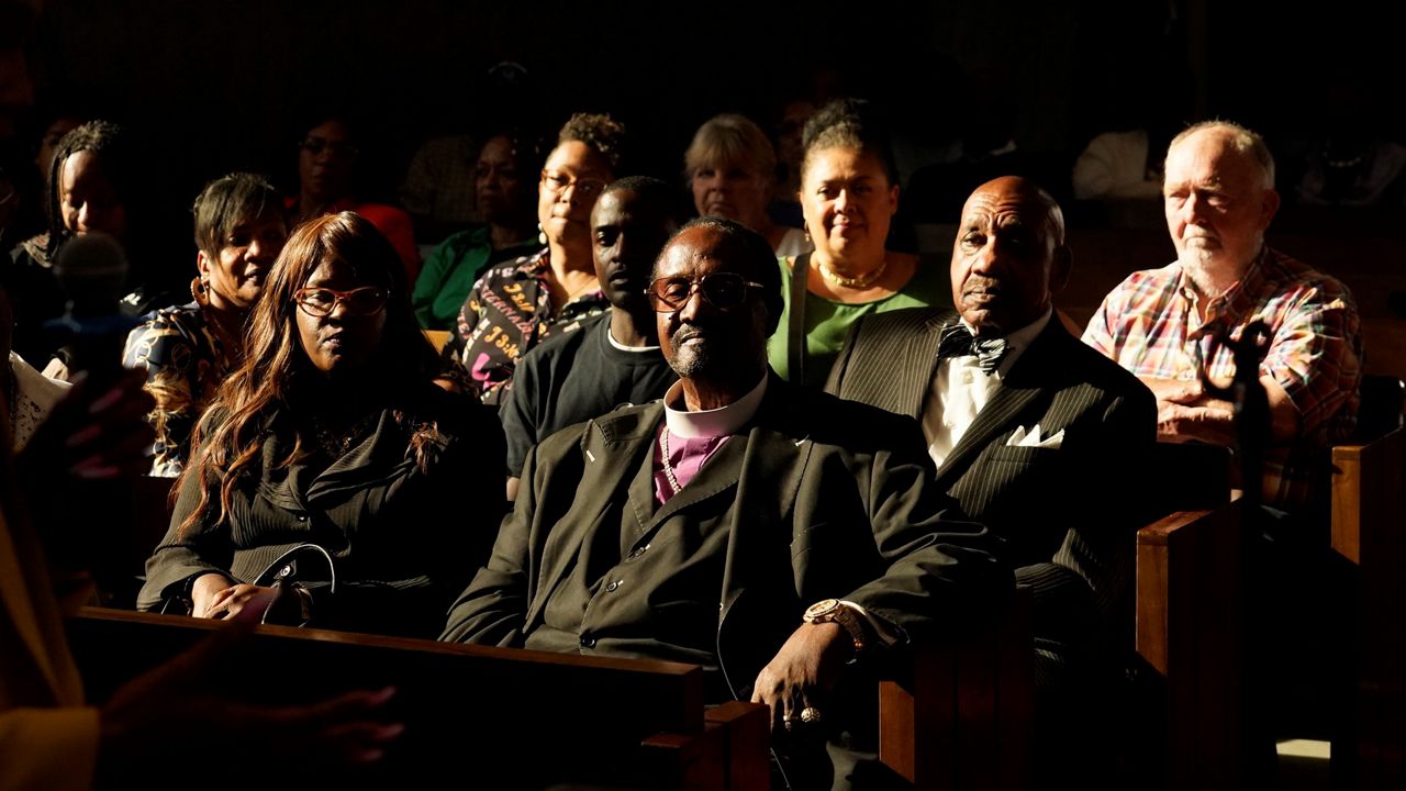 Palm Springs Section 14 survivors and descendants listen to Areva Martin, civil rights attorney, at the United Methodist Church in Palm Springs, Calif., Sunday, April 16, 2023. (AP Photo/Damian Dovarganes)