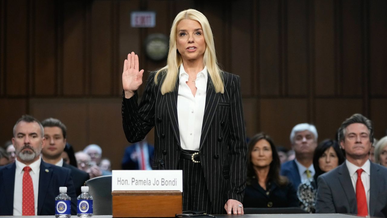 Pam Bondi, President-elect Donald Trump's choice to lead the Justice Department as attorney general, is sworn in before the Senate Judiciary Committee for her confirmation hearing, at the Capitol in Washington, Wednesday, Jan. 15, 2025. (AP Photo/Ben Curtis)