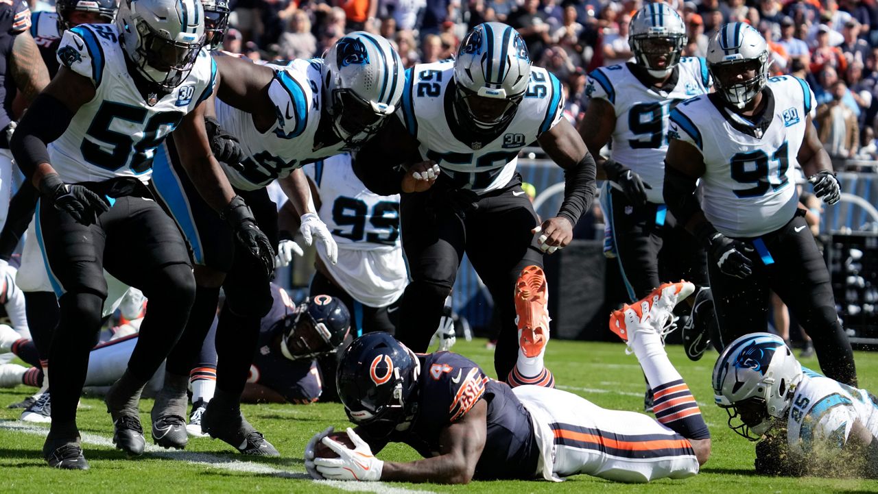 Chicago Bears running back D'Andre Swift (4) is brought down on the one-yard line against the Carolina Panthers during the first half of an NFL football game Sunday, Oct. 6, 2024, in Chicago. (AP Photo/Nam Y. Huh)