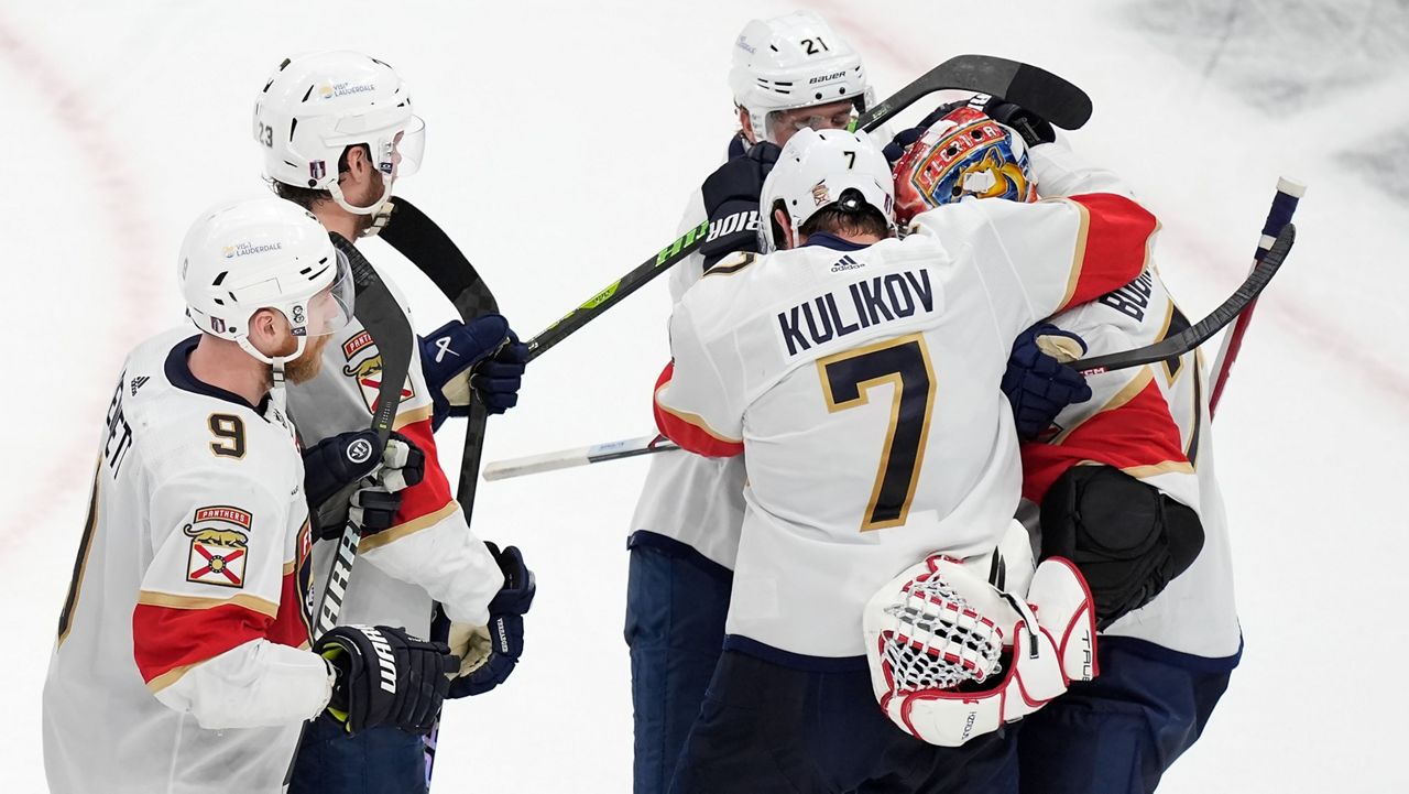 Dmitry Kulikov and Nick Cousins celebrate with Sergei Bobrovsky after defeating the Bruins in Game 6 on Friday, May 17, 2024.