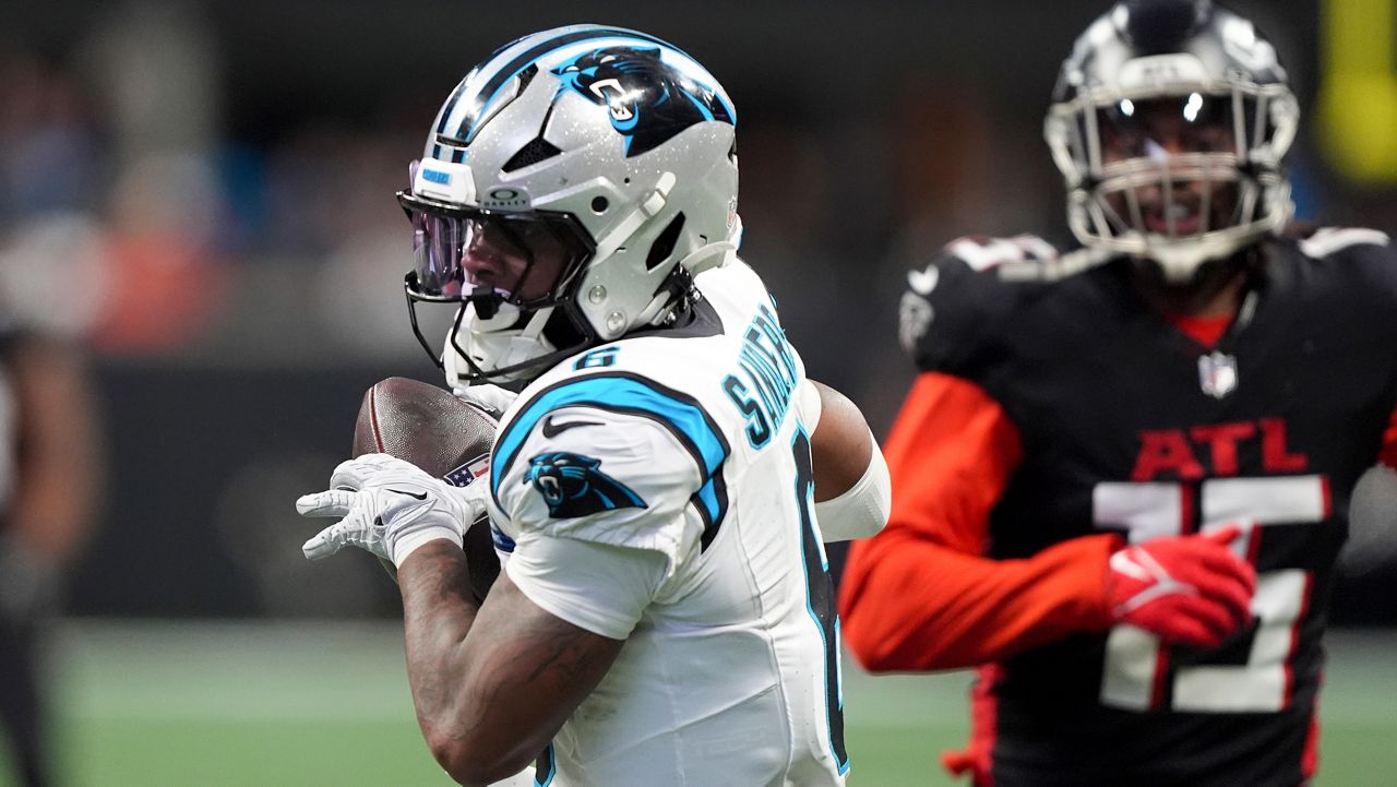 Carolina Panthers running back Miles Sanders scores against the Atlanta Falcons Sunday, Jan. 5, 2025, in Atlanta. (AP Photo/Brynn Anderson)