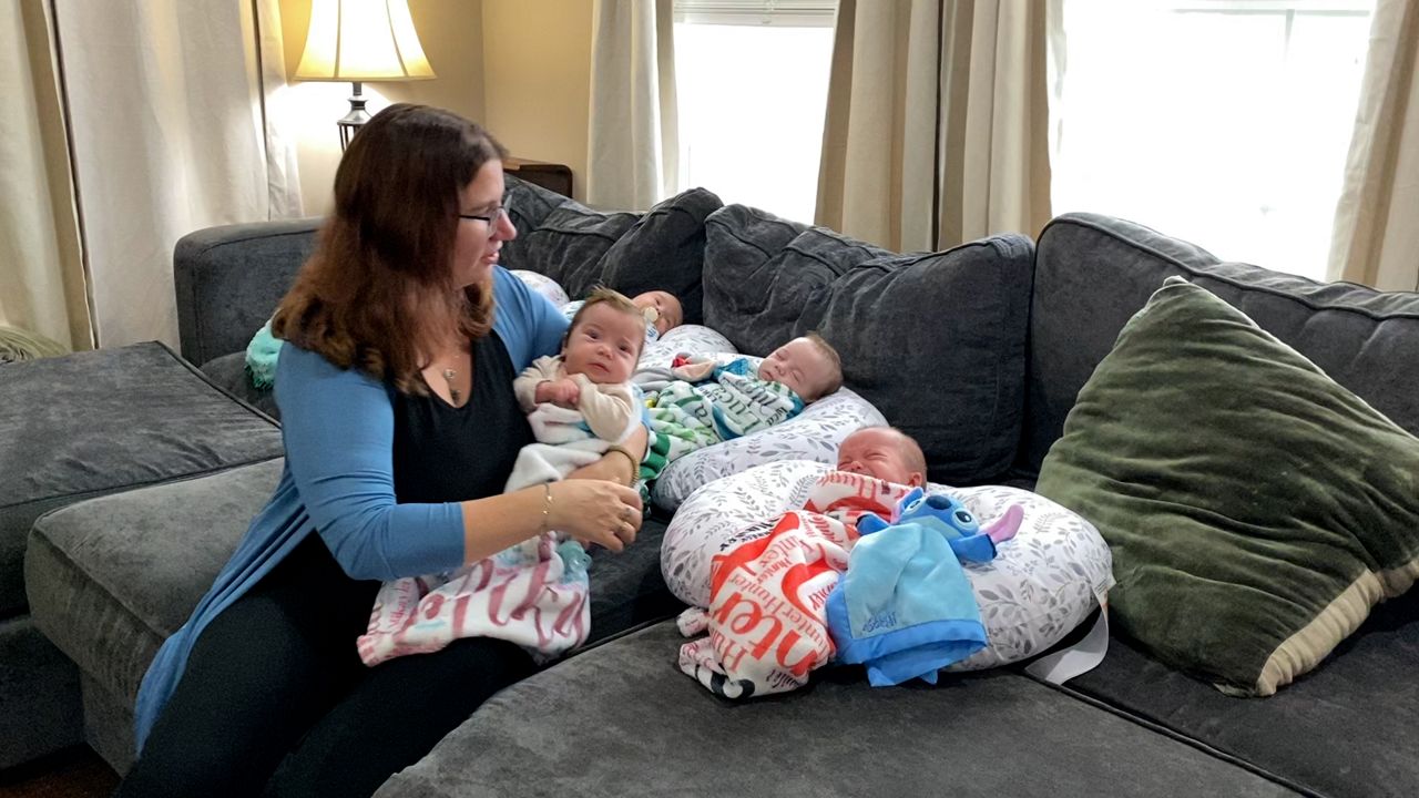 Two years after losing daughter, family quadruplets