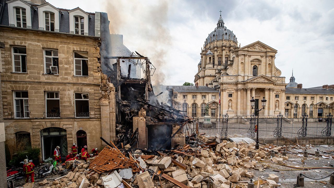 In this photo provided by the Paris Fire brigade on Thursday June 22, 2023, firefighters work at the site of an explosion in Paris, Wednesday, June 21, 2023. French rescue workers searched Thursday for a person feared missing after a powerful blast brought down a building on Paris' Left Bank, injuring more than 30 people, four of them critically. (E Thepault/BSPP via AP)