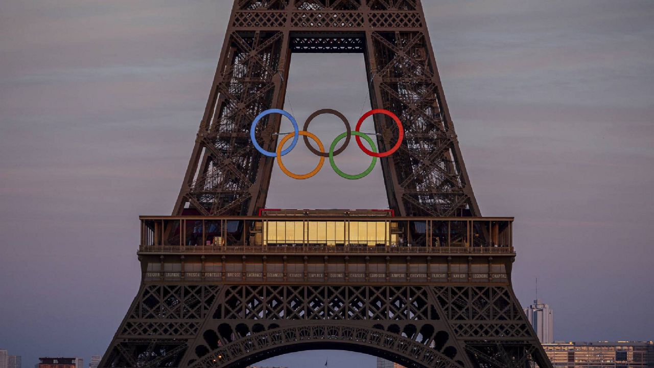 The Olympic rings are mounted on the Eiffel Tower Friday, June 7, 2024 in Paris. (AP Photo/Michel Euler)