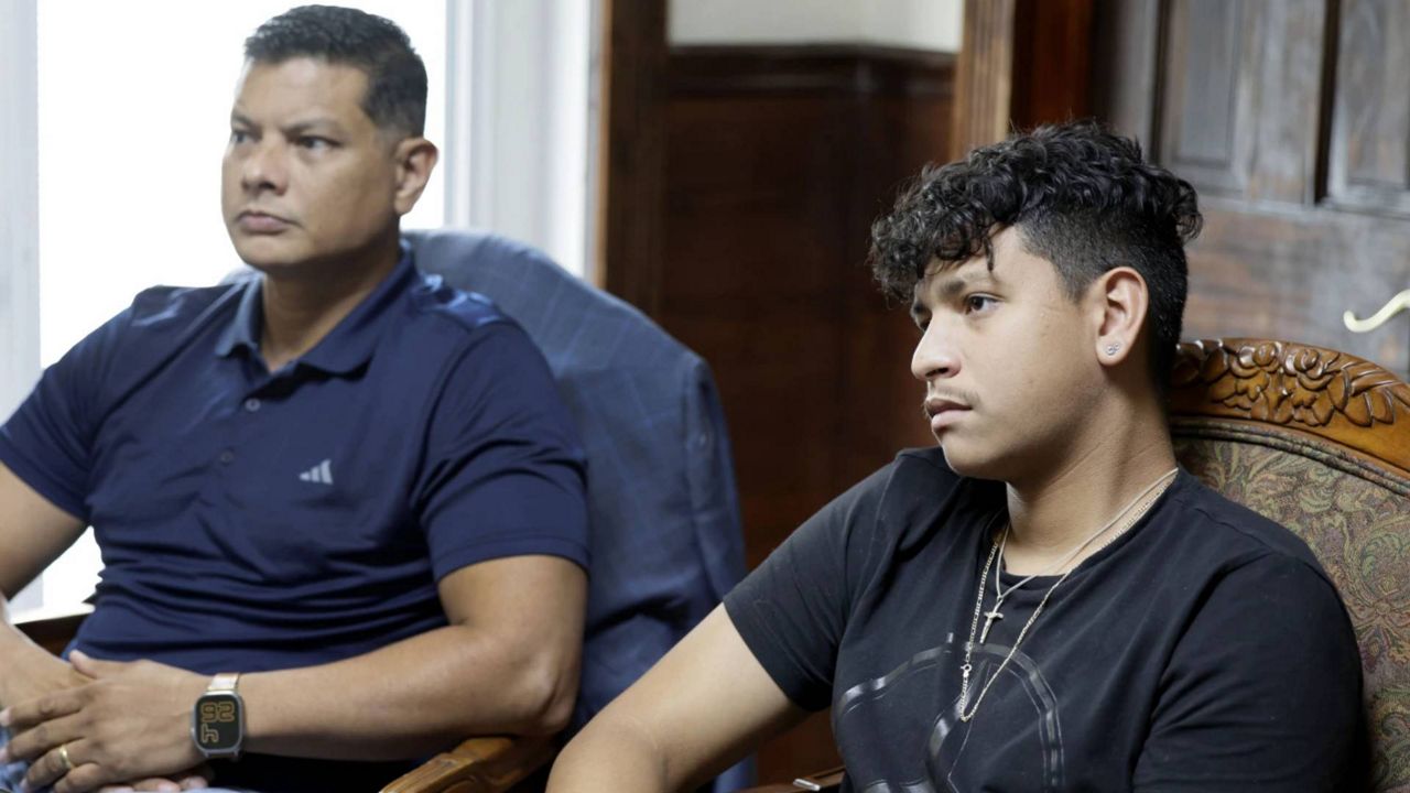 Royer Borges and his son, Parkland shooting victim Anthony Borges sit at their attorney's office in Wilton Manors, Fla., on Wednesday, June 26, 2024. (Carline Jean/South Florida Sentinel via AP)