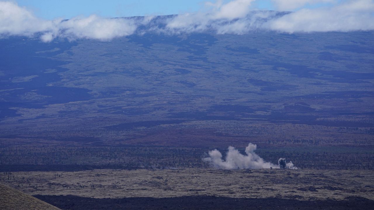 A 155 mm round fired from a howitzer lands in the distance at the Pōhakuloa Training Area in 2020. The grounds have been used for artillery exercises since World War II. (Honolulu Civil Beat/Cory Lum)