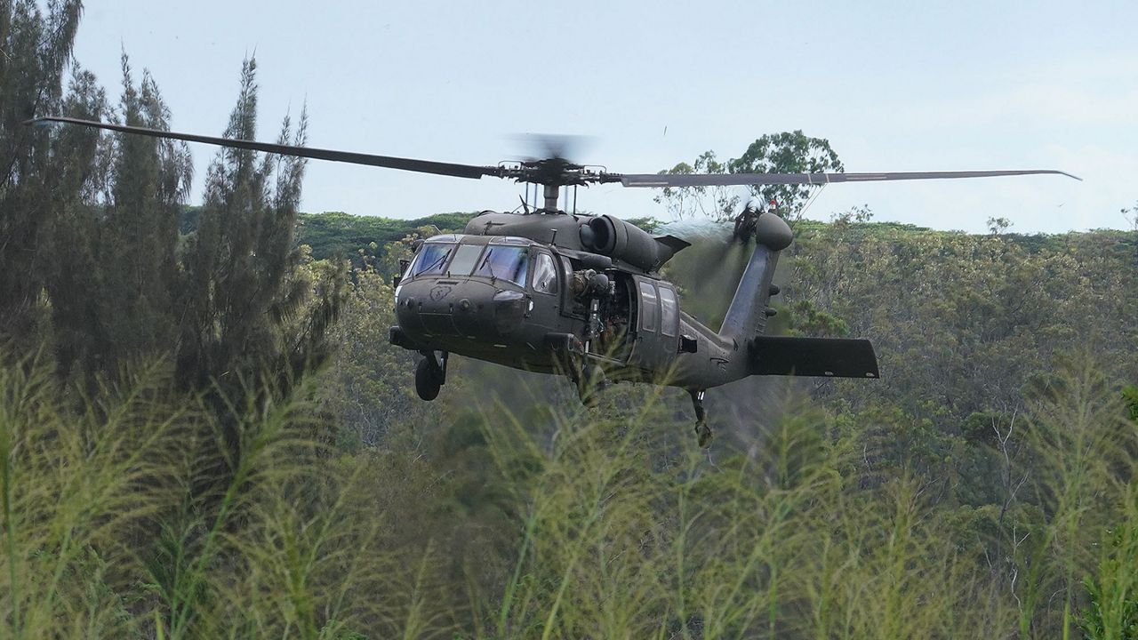A Blackhawk helicopter participates in exercises at the Schofield Barracks East Range in 2021. The lands that the Army proposed giving back to the state include areas that have been mostly used for low-level flight training. (Honolulu Civil Beat/Cory Lum)