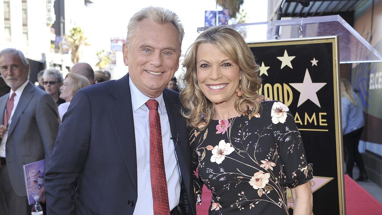 Pat Sajak, left, and Vanna White, from "Wheel of Fortune," attend a ceremony honoring Harry Friedman with a star on the Hollywood Walk of Fame in Los Angeles on Nov. 1, 2019. (Photo by Richard Shotwell/Invision/AP, File)