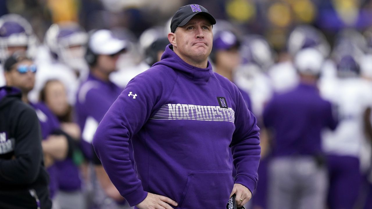 Northwestern football coach Pat Fitzgerald stands on the sideline during a game against Michigan on Oct. 23, 2021, in Ann Arbor, Mich. (AP Photo/Carlos Osorio, File)