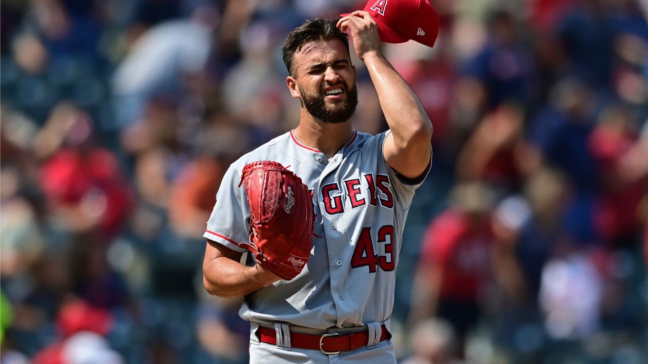 Los Angeles Angels starting pitcher Patrick Sandoval reacts after a solo home run by Cleveland Guardians' Oscar Gonzalez during the second inning of a baseball game, Wednesday, Sept. 14, 2022, in Cleveland. (AP Photo/David Dermer)