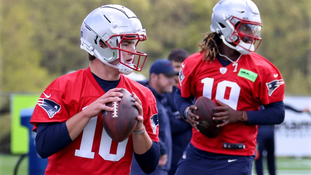 New England Patriots first-round draft pick quarterback Drake Maye, left, and sixth round draft pick quarterback Joe Milton, III, right, run passing drills during the NFL football team's rookie minicamp Saturday, May 11, 2024, in Foxborough, Mass. (AP Photo/Mark Stockwell)