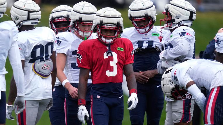 New England Patriots wide receiver DeMario Douglas (3) gathers with teammates during a football practice, Tuesday, Aug. 6, 2024, in Foxborough, Mass. (AP Photo/Charles Krupa)