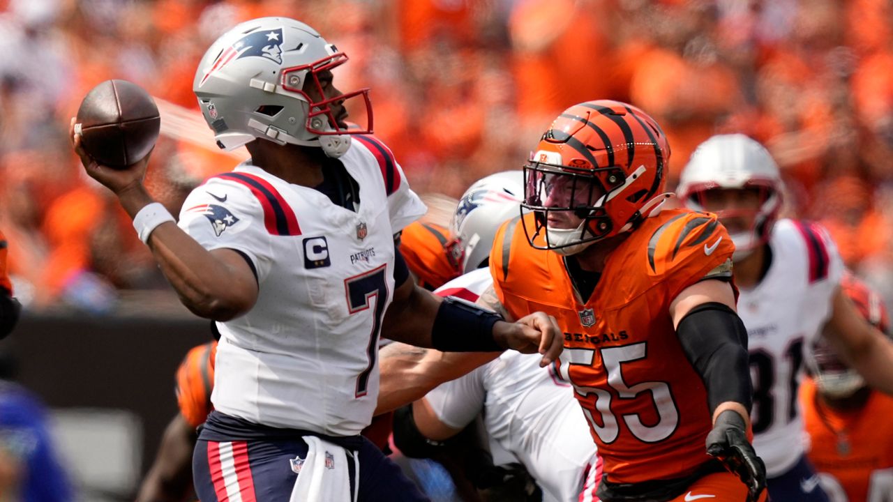 New England Patriots quarterback Jacoby Brissett (7) passes over Cincinnati Bengals linebacker Logan Wilson (55) during the second half of an NFL game, Sunday, Sept. 8, in Cincinnati. (AP Photo/Carolyn Kaster)