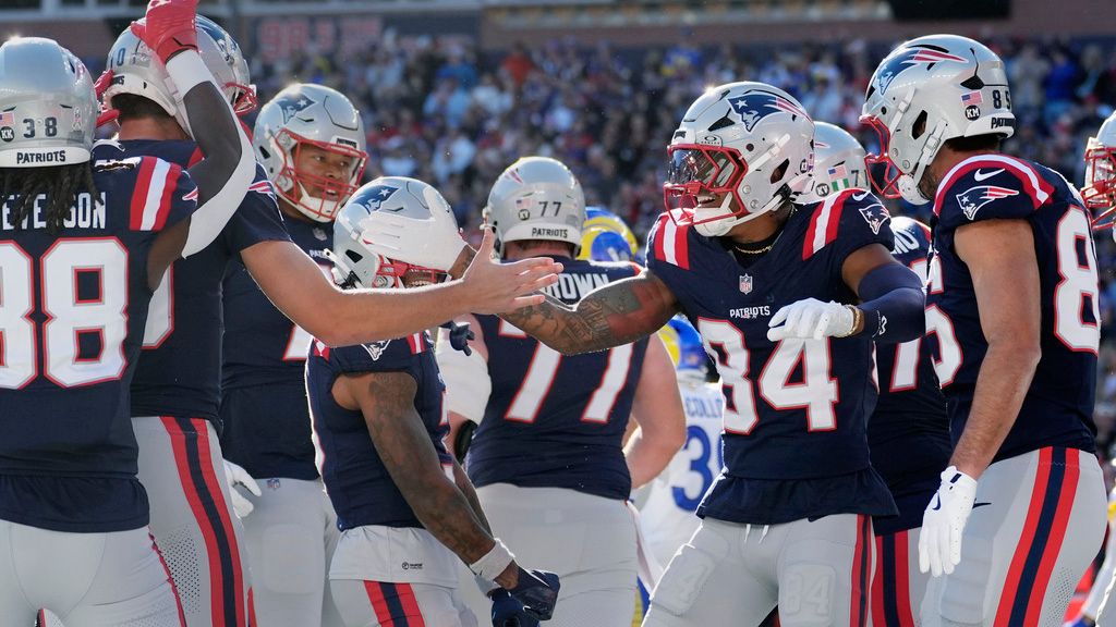 New England Patriots wide receiver Kendrick Bourne (84) is congratulated by quarterback Drake May after his touchdown against the Los Angeles Rams during the first half of an NFL football game, Sunday, Nov. 17, 2024, in Foxborough, Mass. (AP Photo/Michael Dwyer)