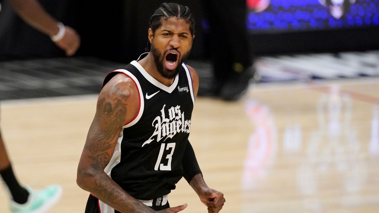 Los Angeles Clippers guard Paul George celebrates after scoring during the first half in Game 3 of the NBA basketball Western Conference Finals against the Phoenix Suns Thursday, June 24, 2021, in Los Angeles. (AP Photo/Mark J. Terrill)