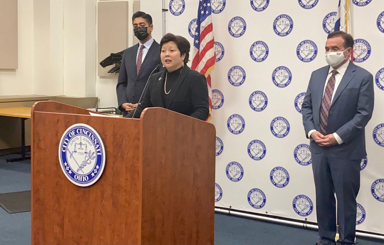 City Manager Paula Boggs Muething speaks at city press conference on COVID-19. She's flanked by Mayor-elect Aftab Pureval (left) and Mayor John Cranley. (Spectrum News/Casey Weldon)