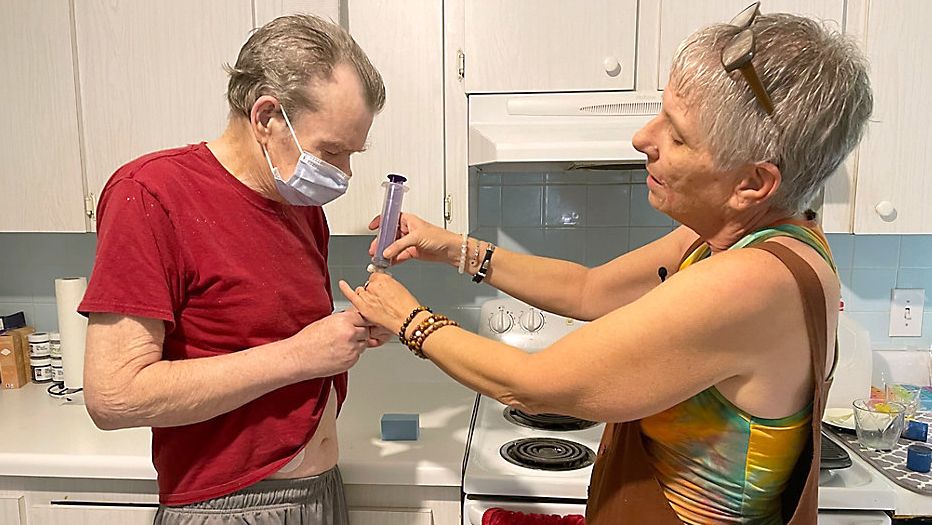 From what he wants to wear to where he wants to be on his last day, as a death doula, Paula Adams helps cancer patient Mark Woodward prepare for his death. (Spectrum Bay News 9/Erin Murray)