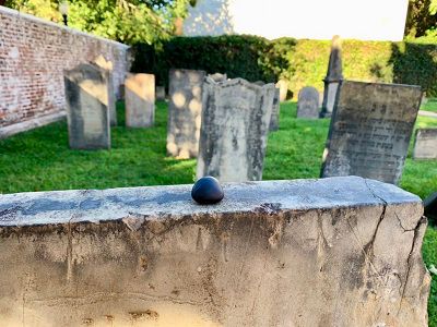 A pebble or stone placed atop a grave marker in Chestnut Street Cemetery in Cincinnati, Ohio. Placing a stone on a gravestone is a popular tradition in Jewish culture.  (Casey Weldon | Spectrum News 1)