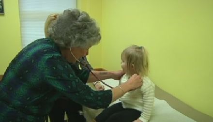 Doctor measuring baby head circumference. Pediatrician place