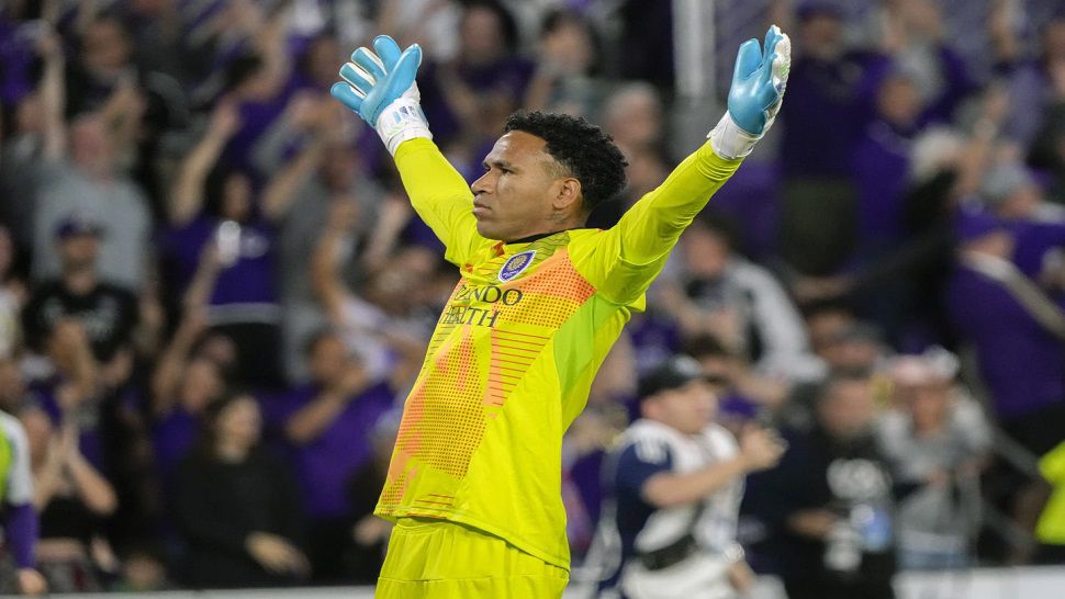 Orlando City goalkeeper Pedro Gallese celebrates in front of fans after defeating Atlanta United in an MLS Semifinal Conference playoff soccer match, Sunday, Nov. 24, 2024, in Orlando, Fla. (AP Photo/John Raoux)