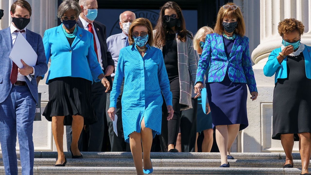 House Speaker Nancy Pelosi, D-Calif., arrives for a rally in support of President Joe Biden's "Build Back Better" for women agenda, at the Capitol in Washington, Friday, Sept. 24, 2021. (AP Photo/J. Scott Applewhite)