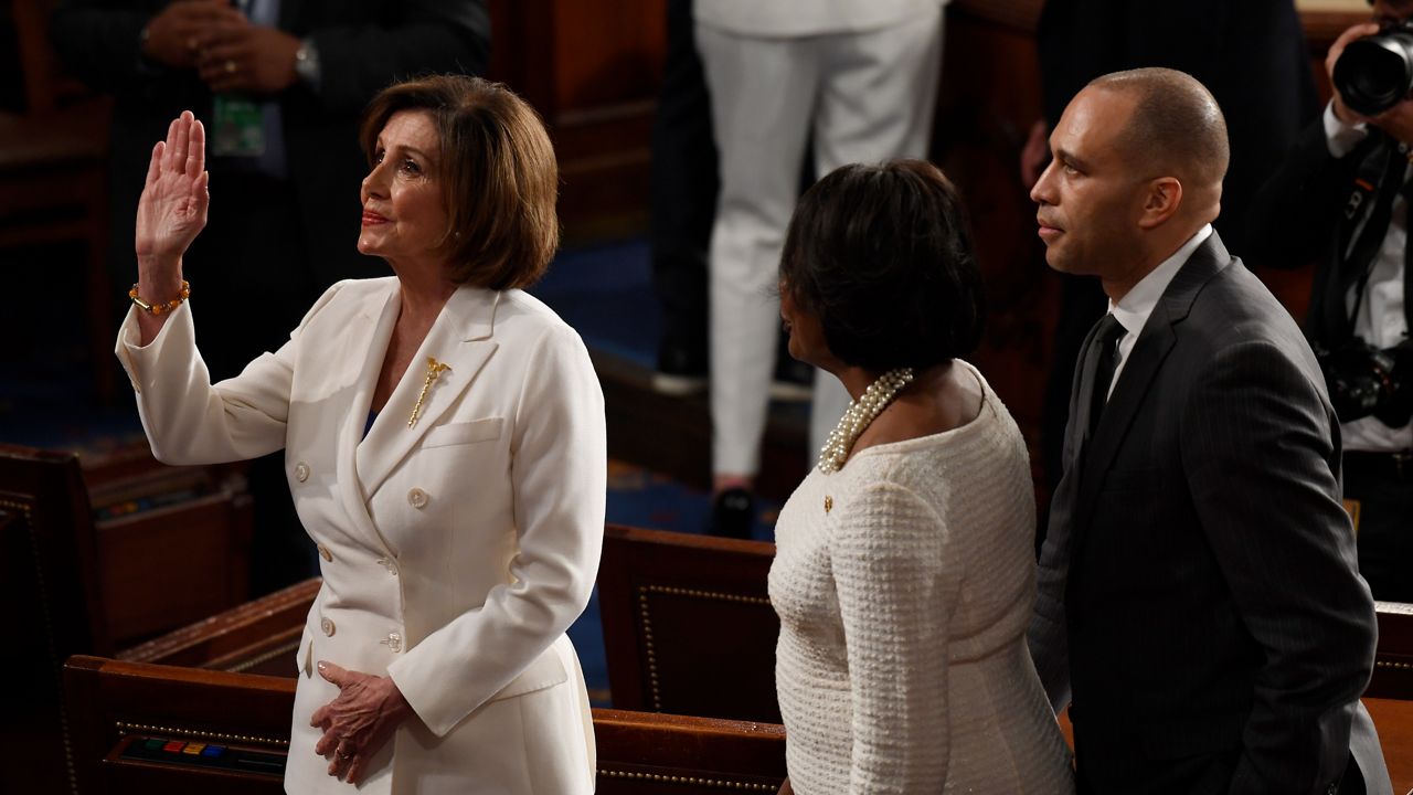House Speaker Nancy Pelosi of Calif., waves as she talks with Rep. Hakeem Jeffries, D-N.Y., and Rep. Val Demings, D-Fla., after President Donald Trump's State of the Union address to a joint session of Congress on Capitol Hill in Washington, Tuesday, Feb. 4, 2020. (AP Photo/Susan Walsh)