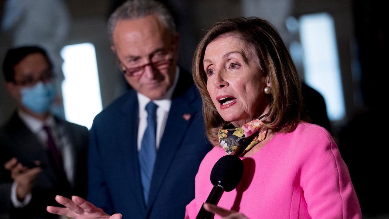 House Speaker Nancy Pelosi of Calif., center, accompanied by Senate Minority Leader Sen. Chuck Schumer of N.Y., left, speak to reporters following a meeting with Treasury Secretary Steven Mnuchin and White House Chief of Staff Mark Meadows as they continue to negotiate a coronavirus relief package on Capitol Hill in Washington, Friday, Aug. 7, 2020. (AP Photo/Andrew Harnik)