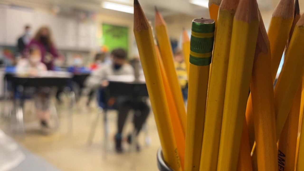 Pencils appear in the foreground of a classroom in this file image. (AP Photo)