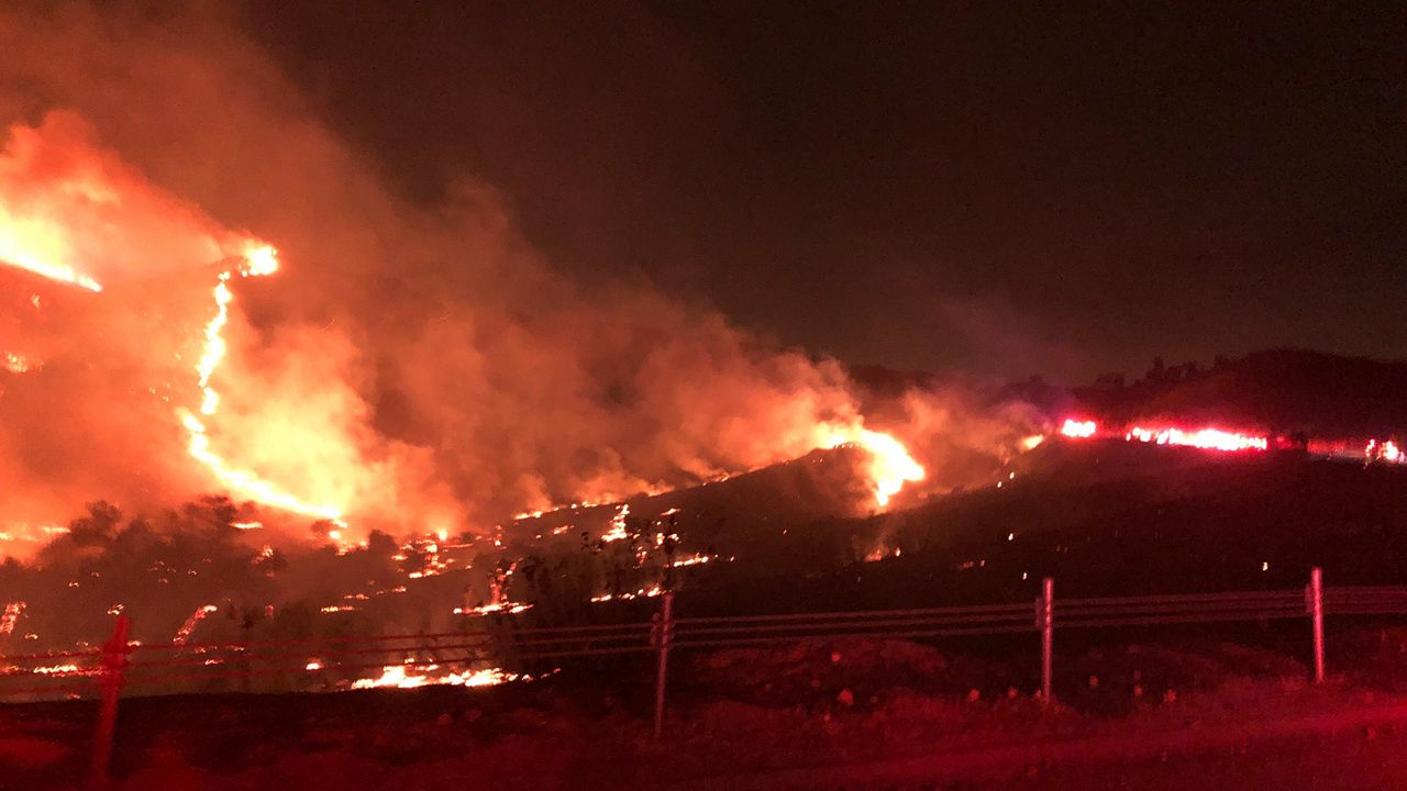 This photo provided by CAL FIRE San Diego shows a wildfire in northern San Diego County early Thursday, Dec. 24, 2020. (CAL FIRE San Diego via AP)