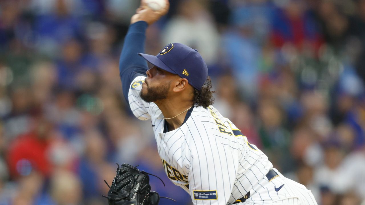 Milwaukee Brewers pitcher Freddy Peralta (51) throws to the Chicago Cubs during the first inning of a baseball game, Sunday, May 4, 2025, in Milwaukee. 