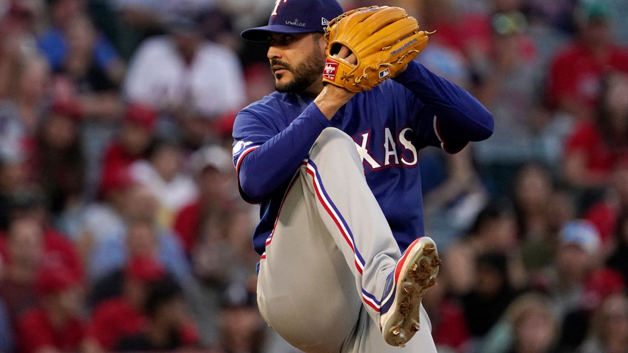 Texas Rangers starting pitcher Martin Perez throws to the plate during the fourth inning of a baseball game against the Los Angeles Angels Friday, July 29, 2022, in Anaheim, Calif. (AP Photo/Mark J. Terrill)